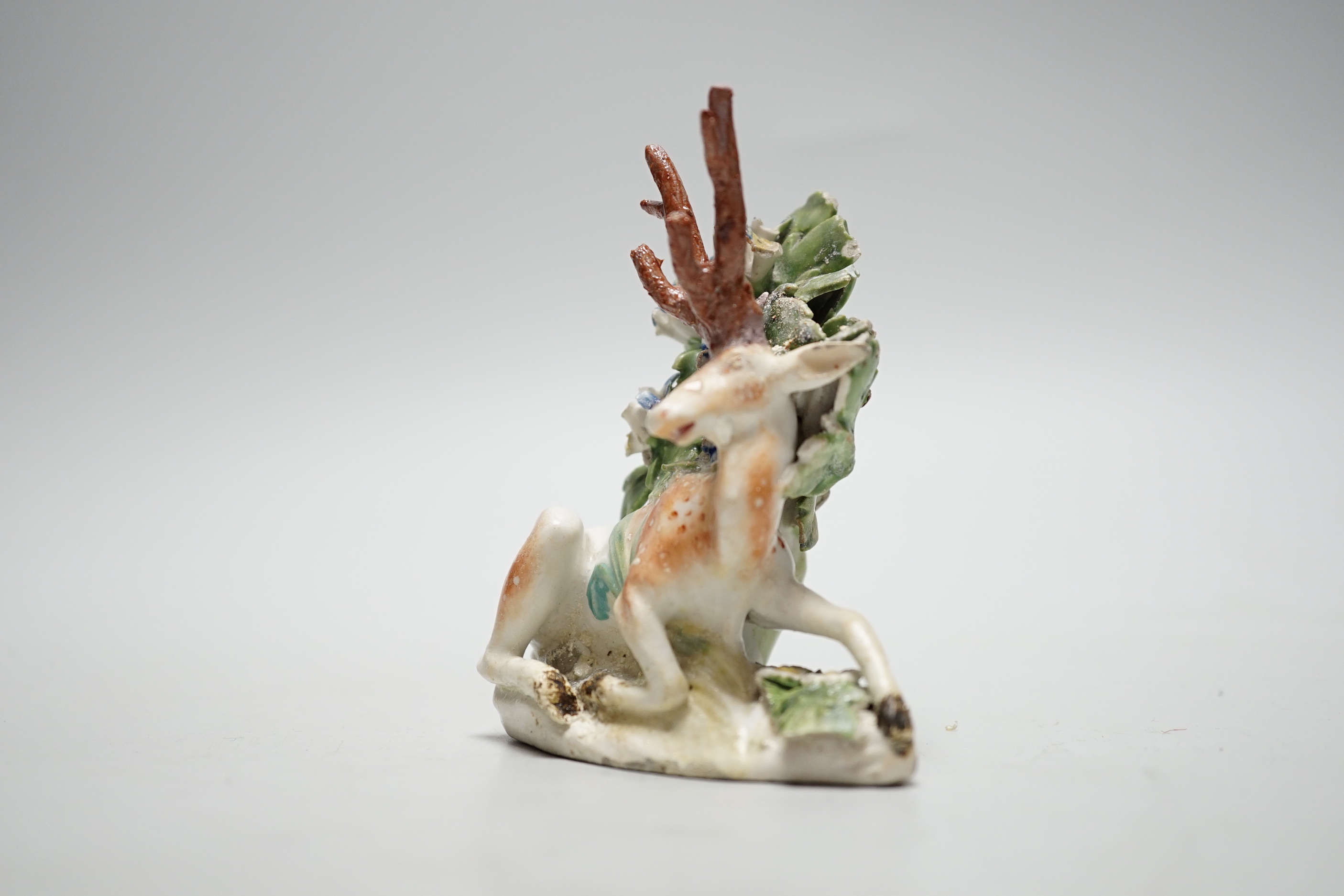A Derby figure of a recumbent deer and bocage, c.1765, 10cm